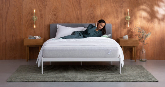 Woman reading a book on a T&N Bed
