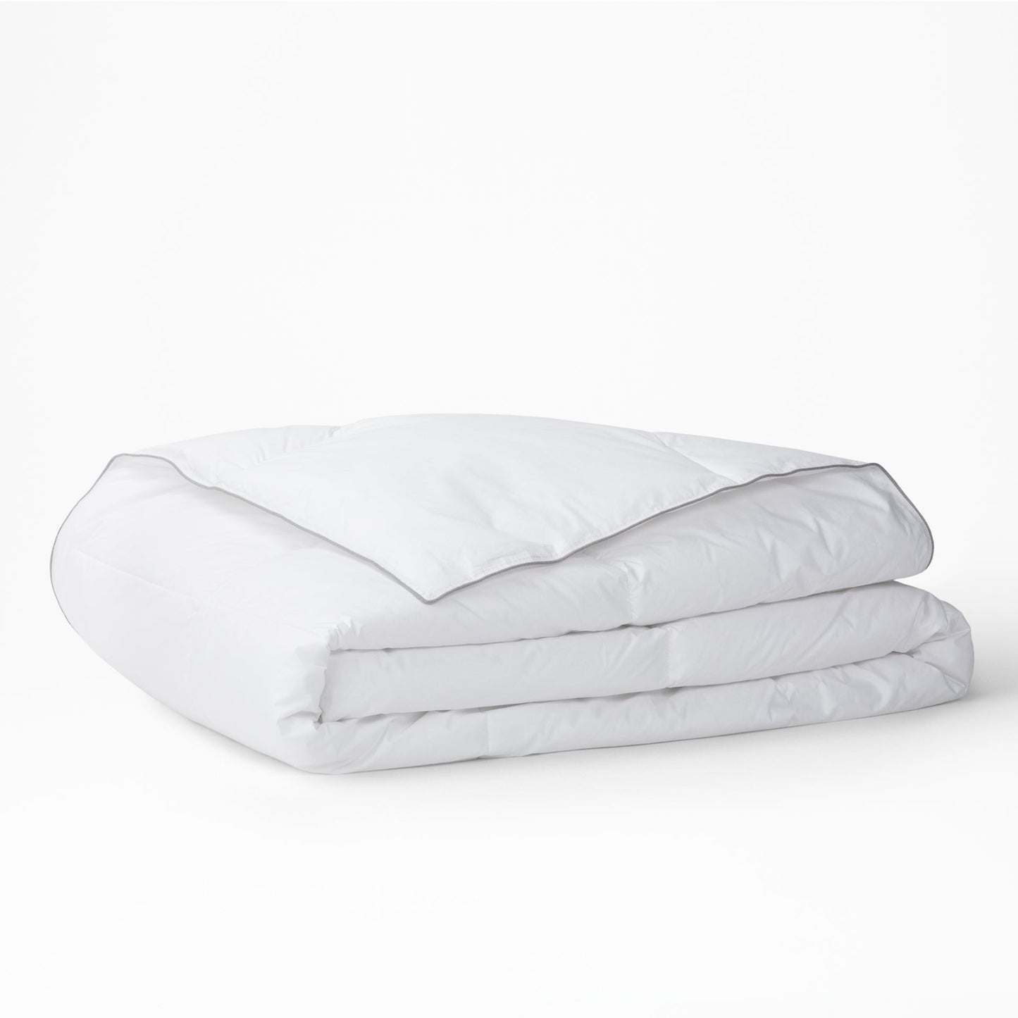The Tuft and Needle Alternative Duvet Insert folded on a white background||weight:medium