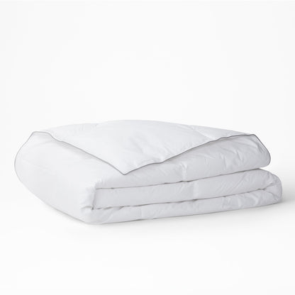The Tuft and Needle Alternative Duvet Insert folded on a white background||weight:medium