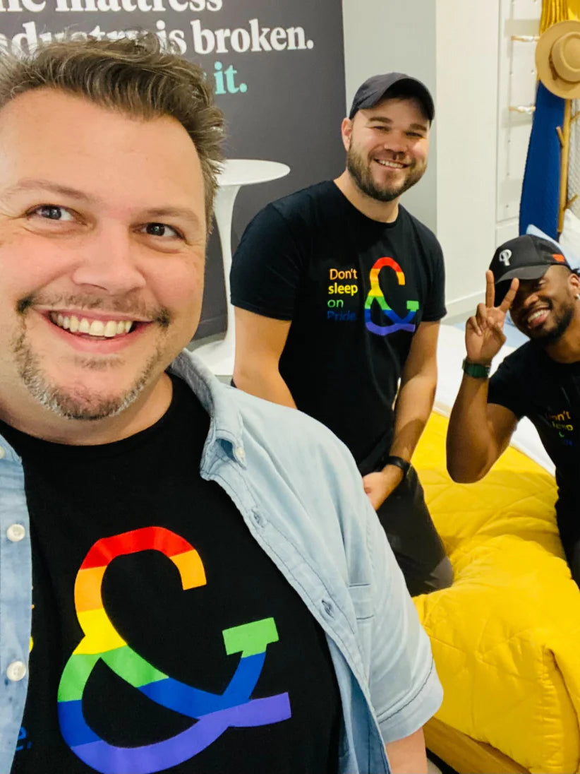 Tuft & Needle employees wearing pride shirts taking a selfie