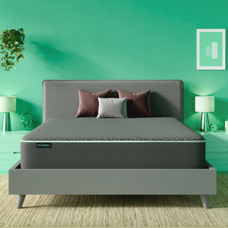 The Tuft and Needle Mint hybrid Mattress II in a green bedroom