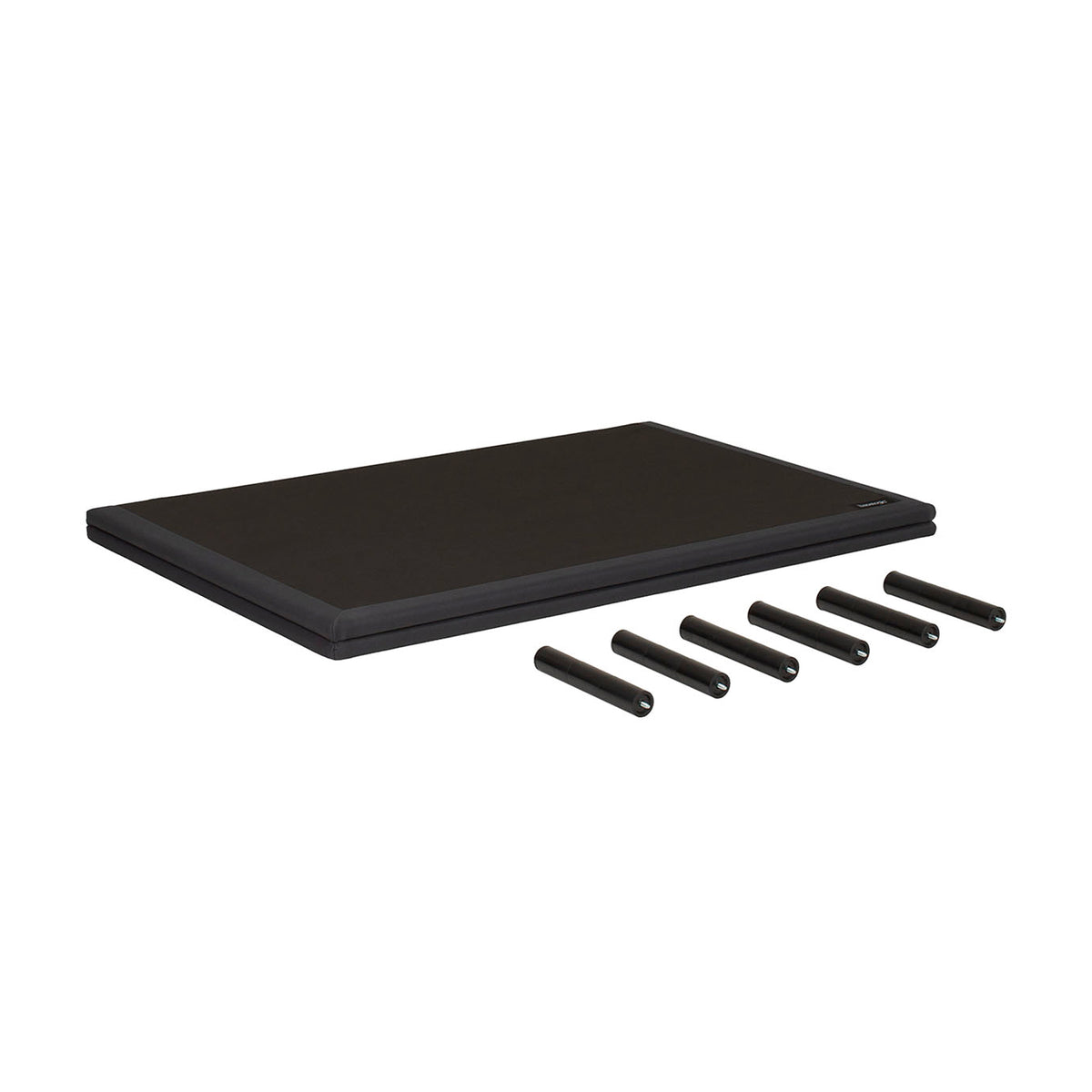 A black rectangular mat or pad shown on a plain white background, with five black cylindrical pieces placed in front of it.