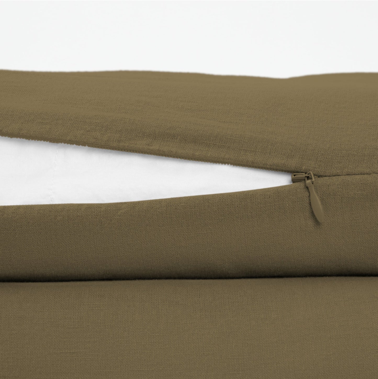The Tuft and Needle Linen-Cotton Blend Duvet Set, zipper closure on the side of the pillow || color: Martini Olive
