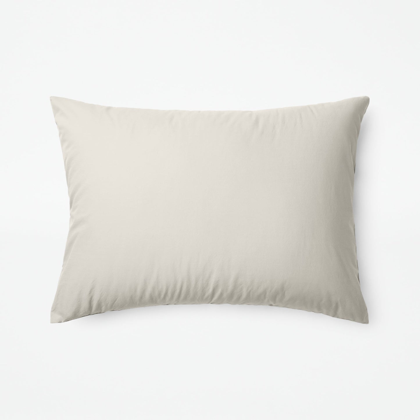 The Tuft and Needle Classic Percale Sheet Set, one pillow laying horizontally || color: Sand
