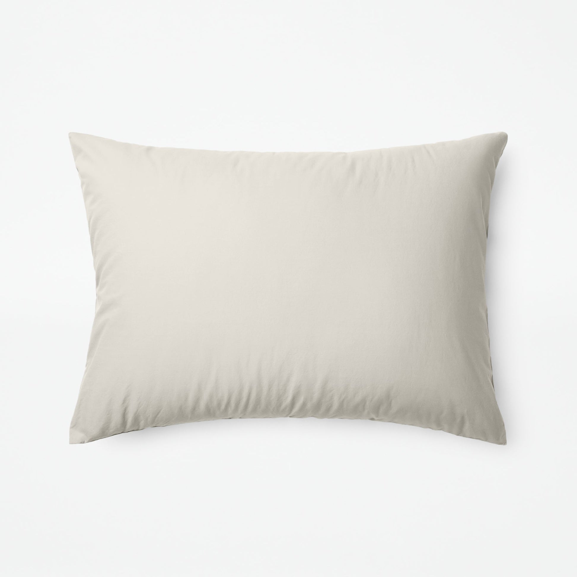 The Tuft and Needle Classic Percale Sheet Set, one pillow laying horizontally || color: Sand
