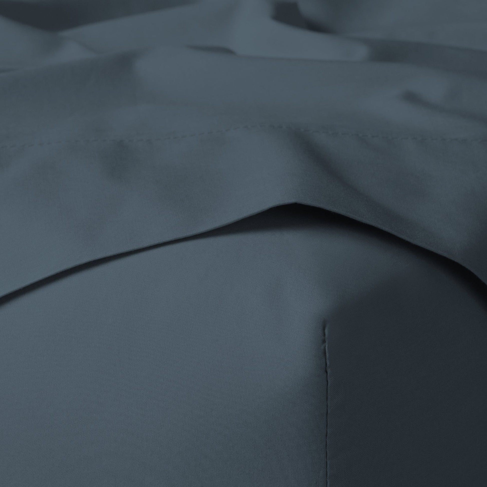 The Tuft and Needle Classic Percale Sheet Set, corner of a mattress with both sheets showing || color: Slate
