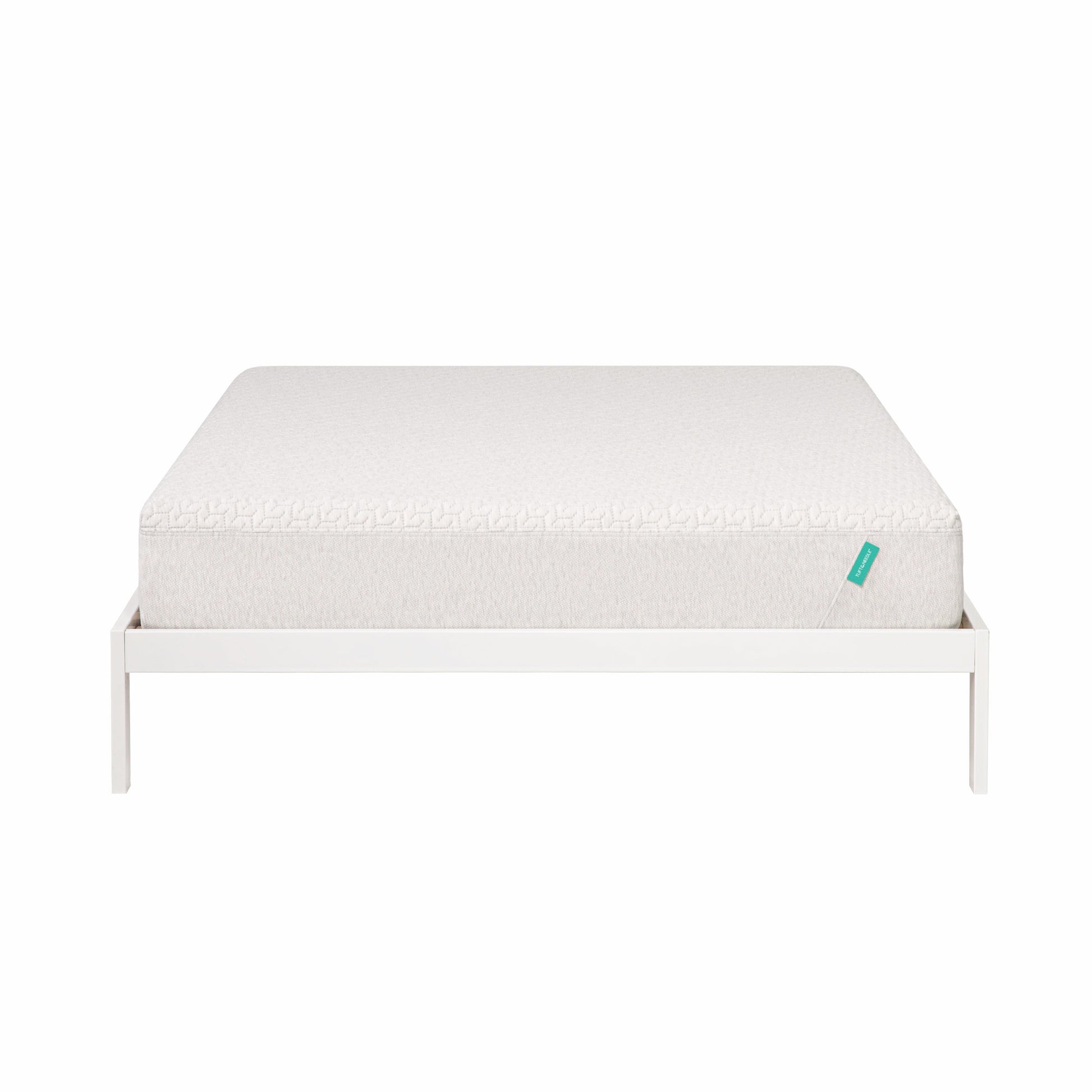 Foam mattress sites on a white bed frame. 
