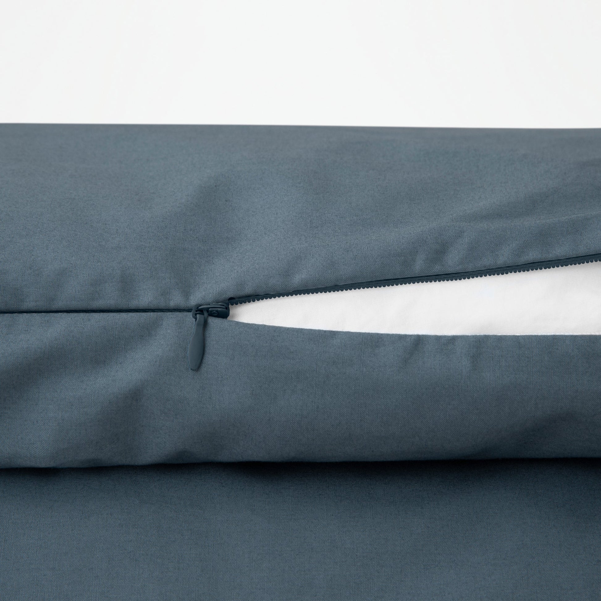Close-up view of the zipper on the Tuft and Needle Percale Duvet Cover Set||color:canyon