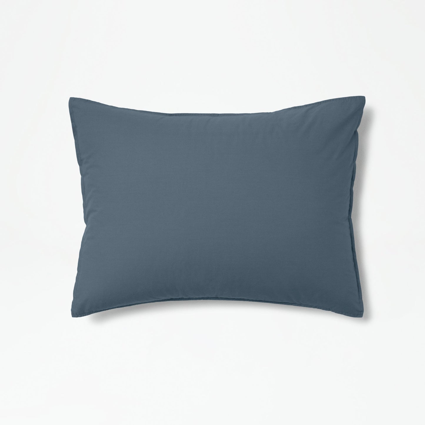 The Tuft and Needle Percale Duvet Cover Set on a pillow ||color:slate