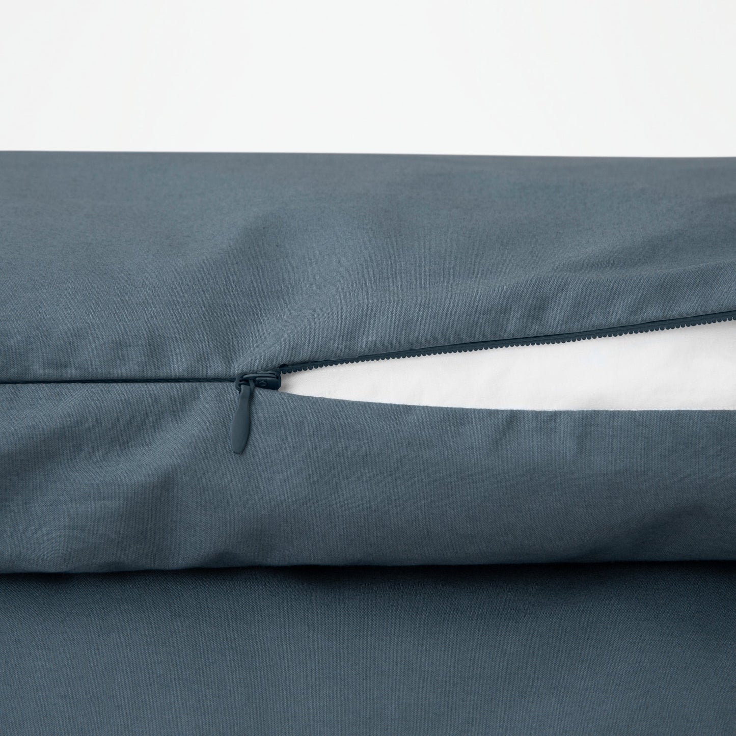 Close-up view of the zipper on the Tuft and Needle Percale Duvet Cover Set||color:sand