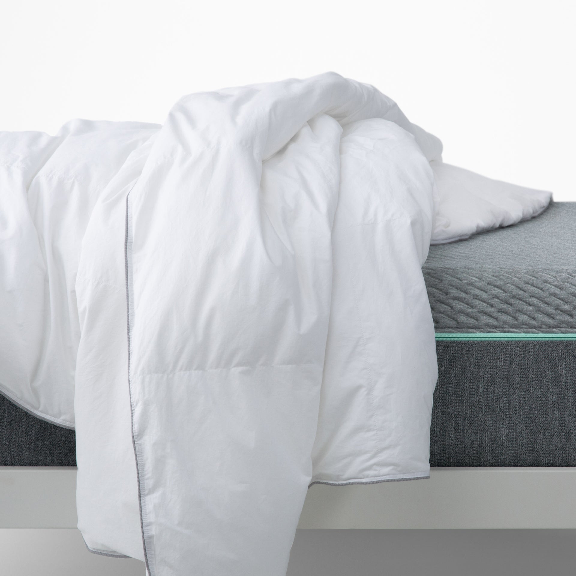 The Tuft and Needle Alternative Duvet Insert laying on a bed||weight:medium